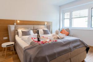 Posteľ alebo postele v izbe v ubytovaní Apartments Galumbo - bleiben & genießen