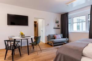 Televízia a/alebo spoločenská miestnosť v ubytovaní Apartments Galumbo - bleiben & genießen