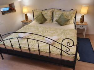 A bed or beds in a room at Karmelita Boutique Apartman
