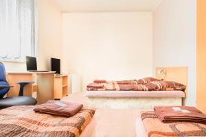 Postel nebo postele na pokoji v ubytování Hotel Zannam