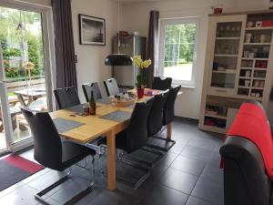 a dining room with a table and chairs at Holiday House Tereza in Lipno nad Vltavou