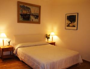 Postel nebo postele na pokoji v ubytování Art Gallery Hotel
