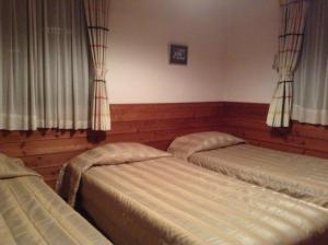 Postel nebo postele na pokoji v ubytování Pension Niimi