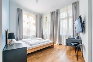 TV a/nebo společenská místnost v ubytování Apartamenty Sun & Snow Międzyzdroje Promenada