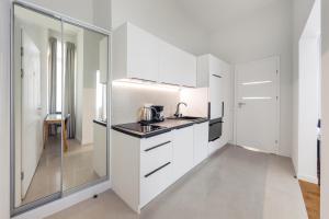 Kuchyň nebo kuchyňský kout v ubytování Apartamenty Sun & Snow Międzyzdroje Promenada