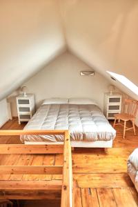 a bedroom with a bed in a attic at Residence SoleNeveSila B&B in Camigliatello Silano