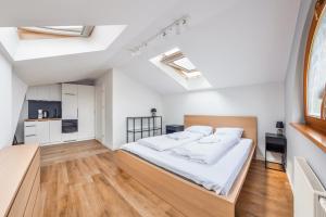 Postel nebo postele na pokoji v ubytování Apartamenty Sun & Snow Międzyzdroje Promenada