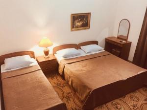 Cama o camas de una habitación en Lacosta Guest House