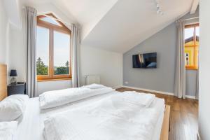 Postel nebo postele na pokoji v ubytování Apartamenty Sun & Snow Międzyzdroje Promenada