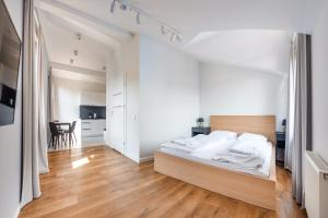 Postel nebo postele na pokoji v ubytování Apartamenty Sun & Snow Międzyzdroje Promenada