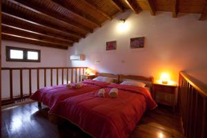 Tempat tidur dalam kamar di Hovolo Hotel Apartments