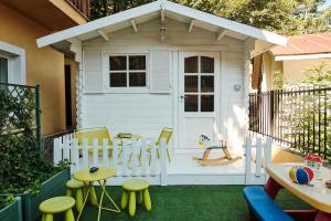 a play house with a table and chairs in front of it at Residence SoleNeveSila B&B in Camigliatello Silano