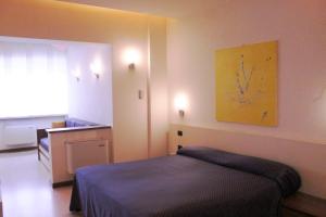 Postel nebo postele na pokoji v ubytování HOTEL OASI