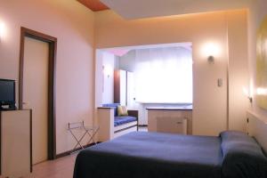 Postel nebo postele na pokoji v ubytování HOTEL OASI