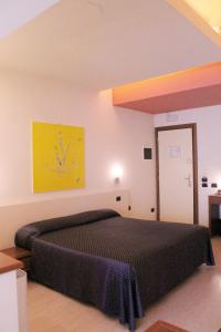Postel nebo postele na pokoji v ubytování HOTEL OASI