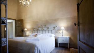 A bed or beds in a room at Casa Fabbrini Agriturismo