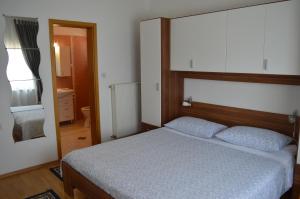 Posteľ alebo postele v izbe v ubytovaní Rooms & Apartments Kvasić
