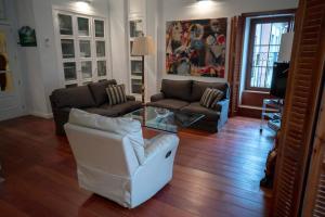 a living room with couches and a glass table at JAGUAR in Avila