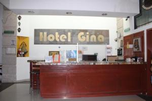 a hotel gma sign on a wall in a room at Hotel Gina in San Juan de los Lagos