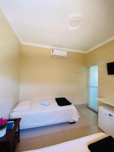 Cama ou camas em um quarto em Hotel Pousada Marra