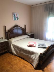 A bed or beds in a room at Casa Hipólito