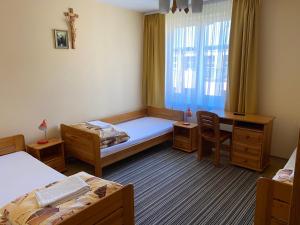 Łóżko lub łóżka w pokoju w obiekcie Ośrodek Gwiazda Morza