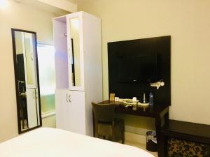 Ένα ή περισσότερα κρεβάτια σε δωμάτιο στο BW Starfire Hotel