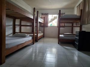 Postel nebo postele na pokoji v ubytování Downtown Hostel Chetumal