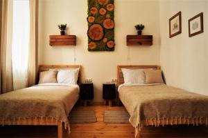 Postel nebo postele na pokoji v ubytování DABA Mini Hotel