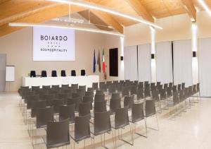 a conference room with chairs in the middle of it at Boiardo Hotel in Scandiano