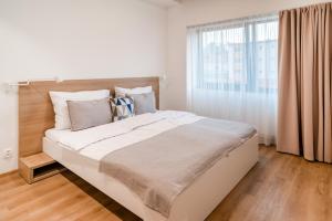 Postel nebo postele na pokoji v ubytování ARMEX LiveCentrum