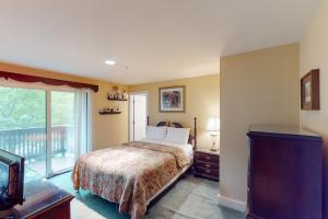 Ένα ή περισσότερα κρεβάτια σε δωμάτιο στο Bromley Mountain Condo CD2