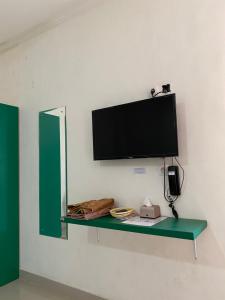 TV o dispositivi per l'intrattenimento presso Anugrah Inn