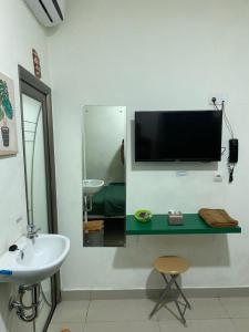 TV o dispositivi per l'intrattenimento presso Anugrah Inn