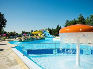 a pool with a water park with a water slide at GRS Mobil Home in Onzain
