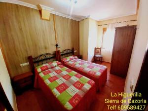 A bed or beds in a room at Alojamientos Rurales La Higuerilla Sierra de Cazorla