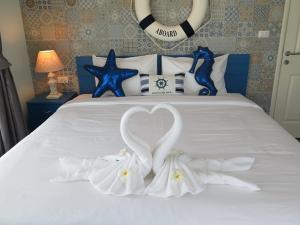 Postel nebo postele na pokoji v ubytování Baan Imm Aim Huahin sea view