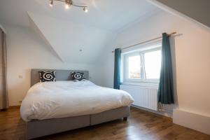 Postel nebo postele na pokoji v ubytování Grand appartement Marie-Thérèse