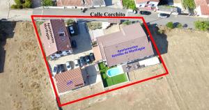an overhead view of a building with a red rectangle at Apartamentos Estrellas de Monfragüe in Torrejón el Rubio