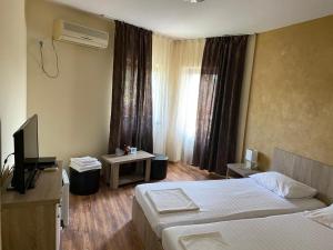 Postel nebo postele na pokoji v ubytování Pensiunea Casa Soarelui