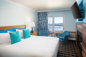 a hotel room with a bed and a view of the water at Beach Retreat & Lodge at Tahoe in South Lake Tahoe