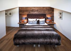Postel nebo postele na pokoji v ubytování Alpines Gourmet Hotel Montanara