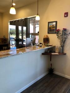 a kitchen with a counter with a laptop on it at Sedona Village Lodge in Sedona