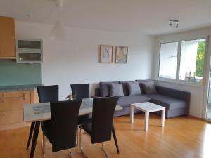 a living room with a couch and a table at Ferienwohnung Anjele in Höchst