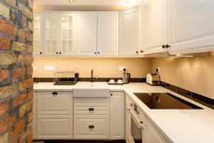 A cozinha ou cozinha compacta de Molloys Apartments