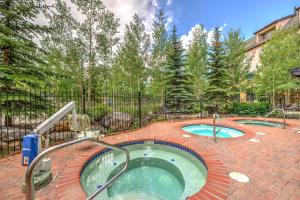 a hot tub in a brick patio with two pools at Main Street Station in Breckenridge