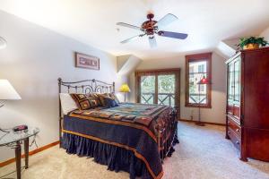 a bedroom with a bed and a ceiling fan at Main Street Station III in Breckenridge