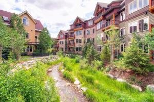 a path in the middle of a row of buildings at Main Street Station in Breckenridge