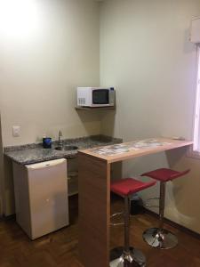 A cozinha ou cozinha compacta de Vila Stellino Suítes