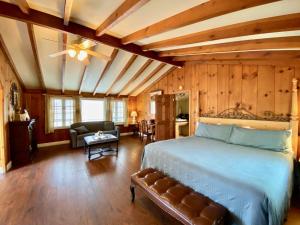 a bedroom with a bed and a living room at The M Solvang in Solvang